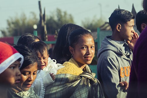 A mother and her kid in a Christmas procession in Shillong, Northeast India, December 2024